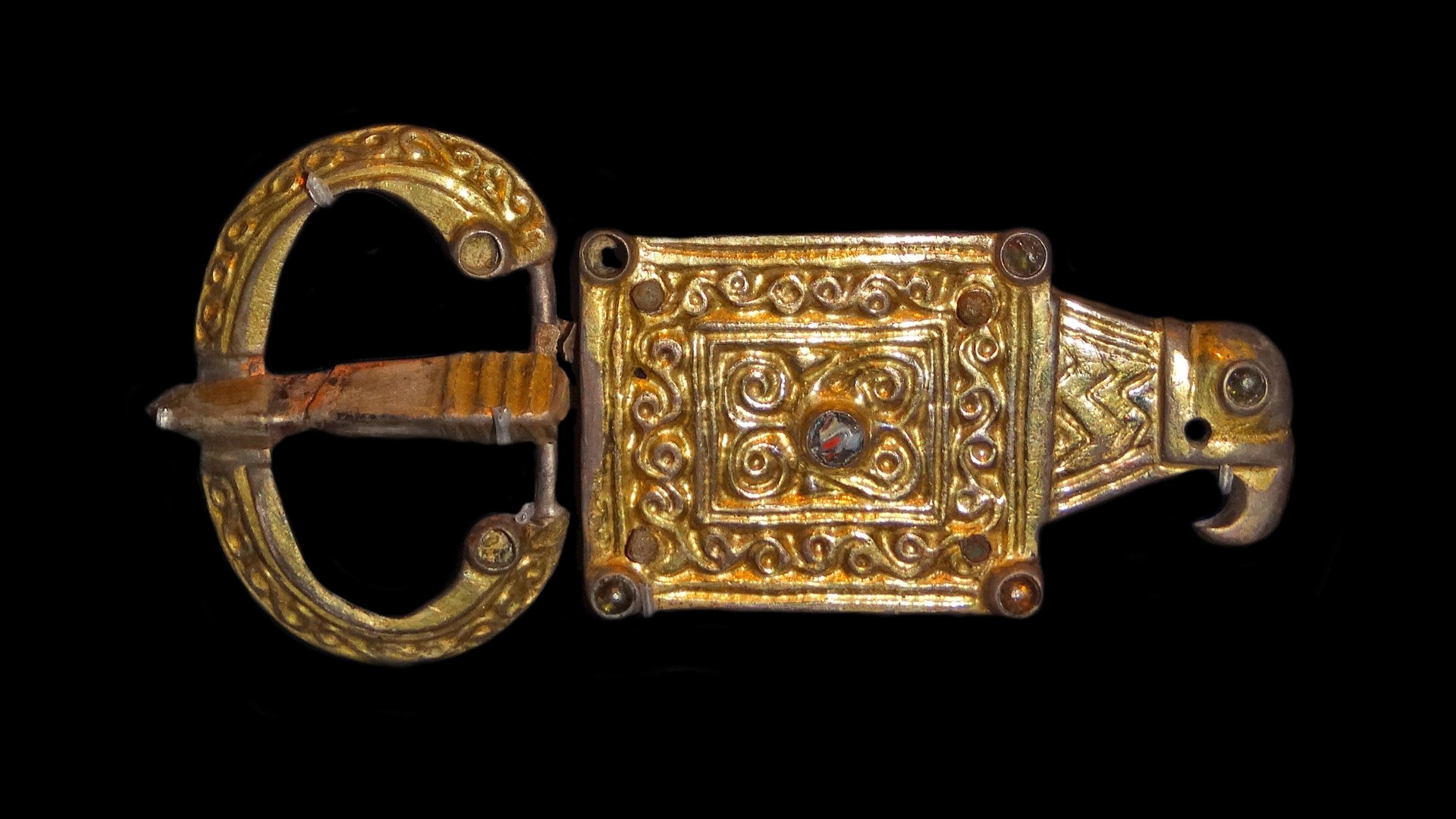 Gothic style buckle with rectangular plate deriving from Roman forms. The decoration reveals regional Gothic fashion. The gilded silver buckle with an eagle's head is typical of the northern Black Sea area which was settled by Crimean Goths. A.D. 400- 660.
