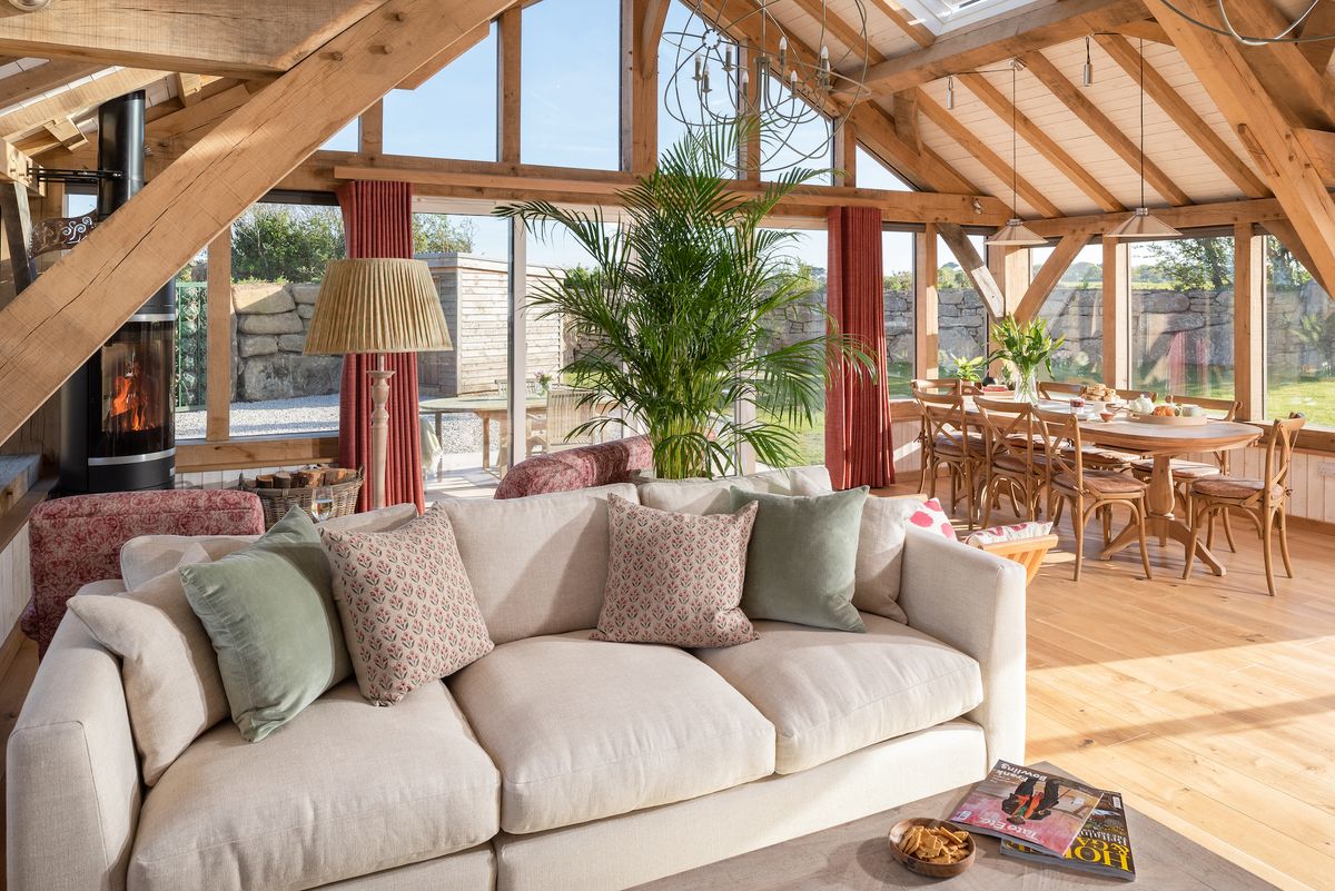 living room with vaulted ceiling and oak frame