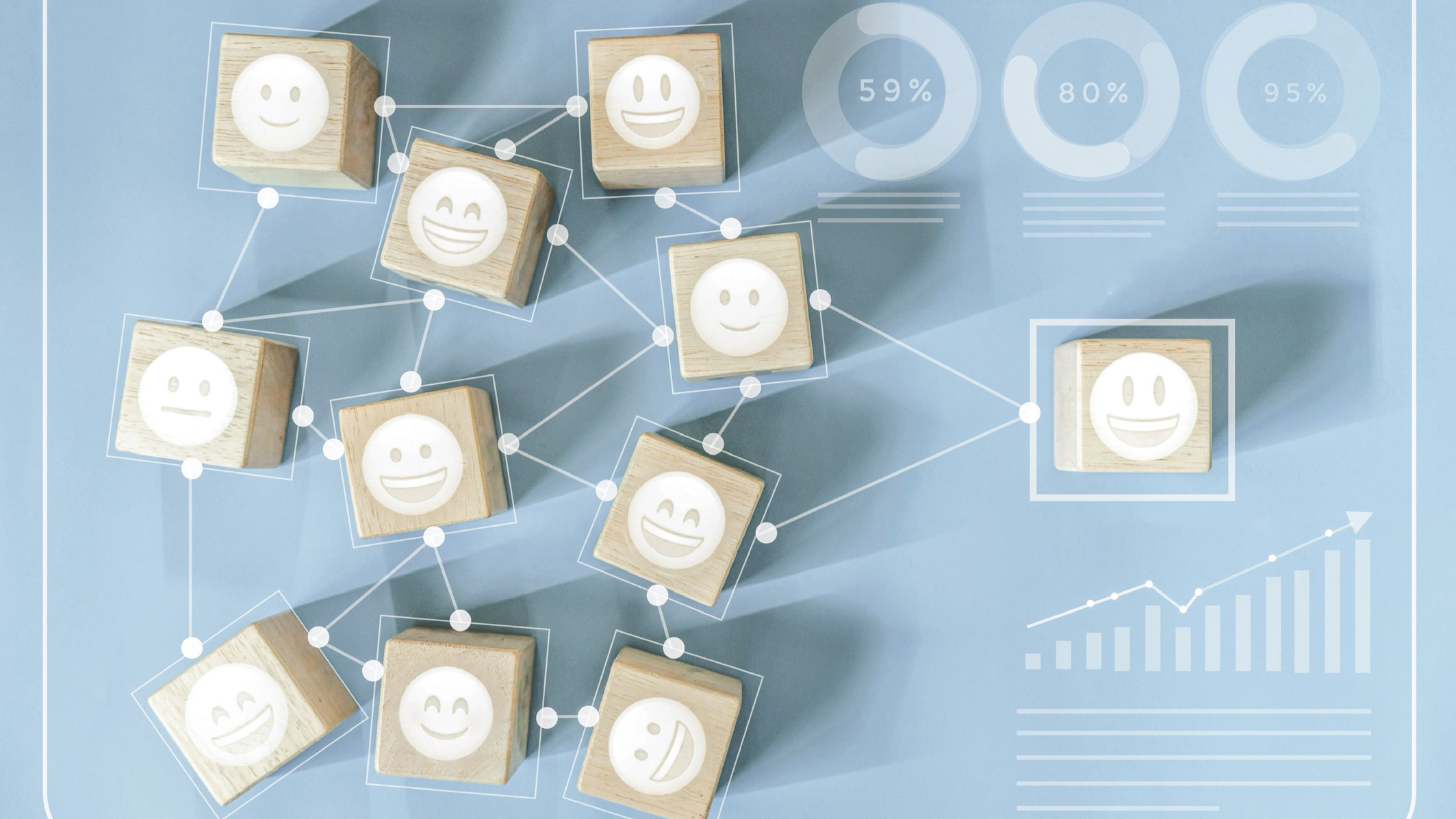 icons of smiley faces on small wooden blocks with one standing out from the rest