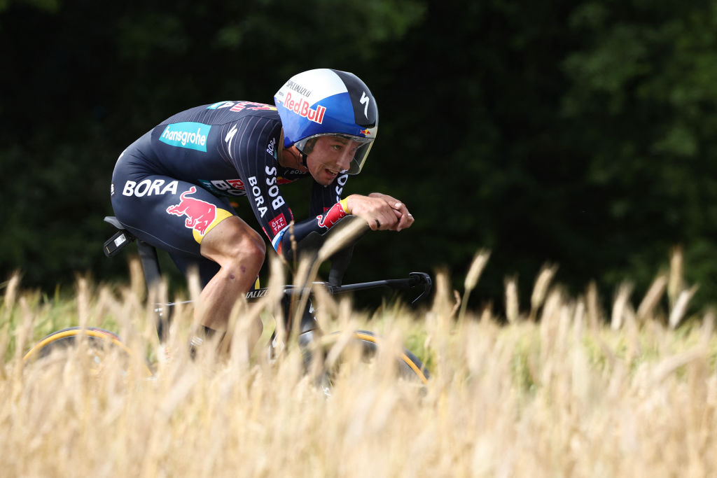 Red Bull - BORA - hansgrohe team's Slovenian rider Primoz Roglic cycles during the 7th stage of the 111th edition of the Tour de France cycling race, 25,3 km individual time trial between Nuits-Saint-Georges and Gevrey-Chambertin, on July 5, 2024. (Photo by Anne-Christine POUJOULAT / AFP)