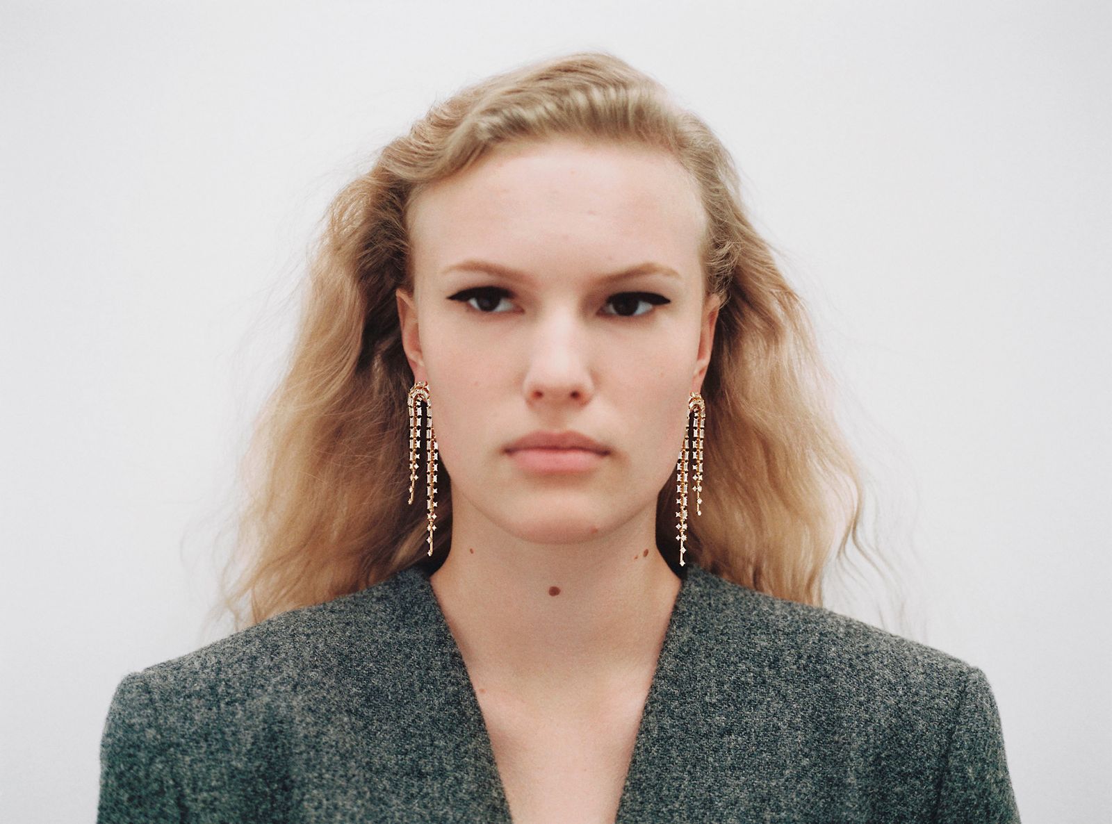 model wears earrings