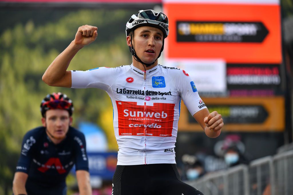 LAGHI DI CANCANO ITALY OCTOBER 22 Arrival Jai Hindley of Australia and Team Sunweb White Best Young Rider Jersey Celebration Tao Geoghegan Hart of The United Kingdom and Team INEOS Grenadiers during the 103rd Giro dItalia 2020 Stage 18 a 207km stage from Pinzolo to Laghi di Cancano Parco Nazionale dello Stelvio 1945m girodiitalia Giro on October 22 2020 in Laghi di Cancano Italy Photo by Stuart FranklinGetty Images