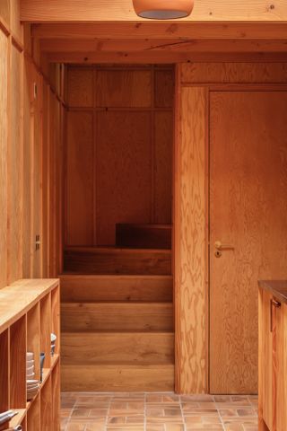 timber and brick interior of Studio Weave house in Devon