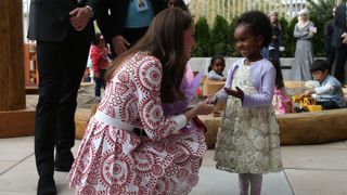Kate Middleton with a young girl