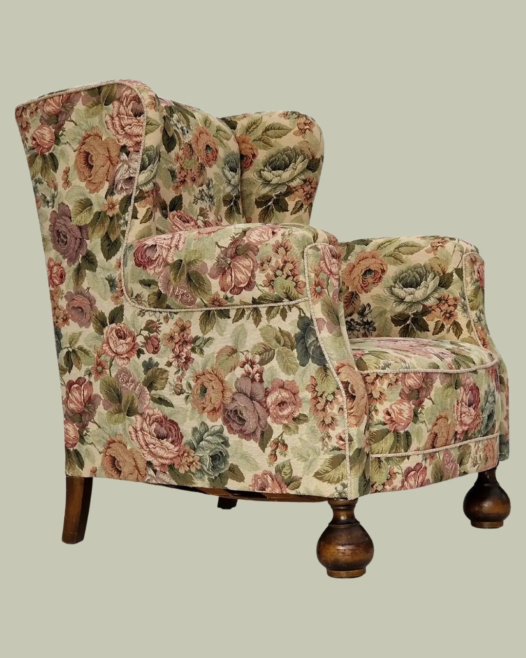 1950s, Danish Vintage Relax Chair in Floral Fabric against pale green background.