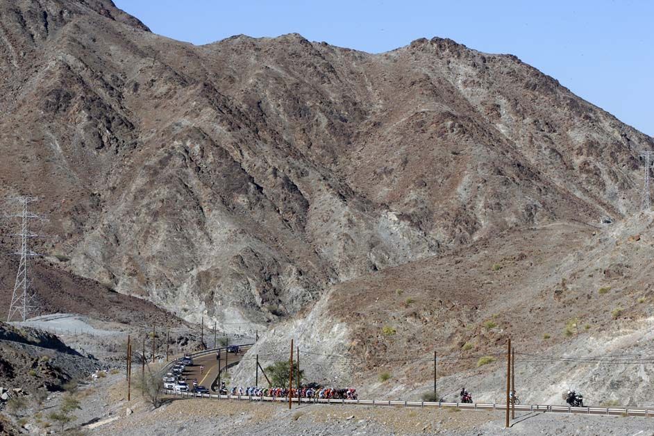 The peloton begins to climb