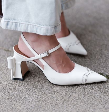 PARIS, FRANCE - MARCH 30: Natalia Verza wears white pointed shoes “coquette style” by Shushu Tong, during a street style fashion photo session, on March 30, 2024 in Paris, France. (Photo by Edward Berthelot/Getty Images)