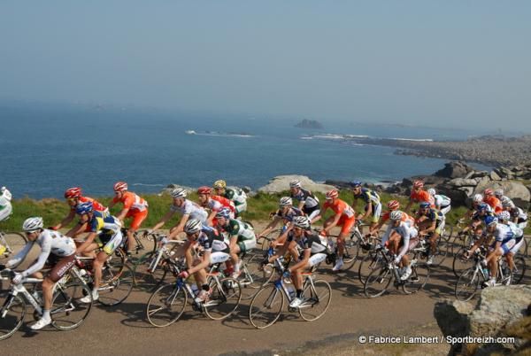 The peloton races along the Breton coast.