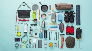 Camping equipment laid out flat