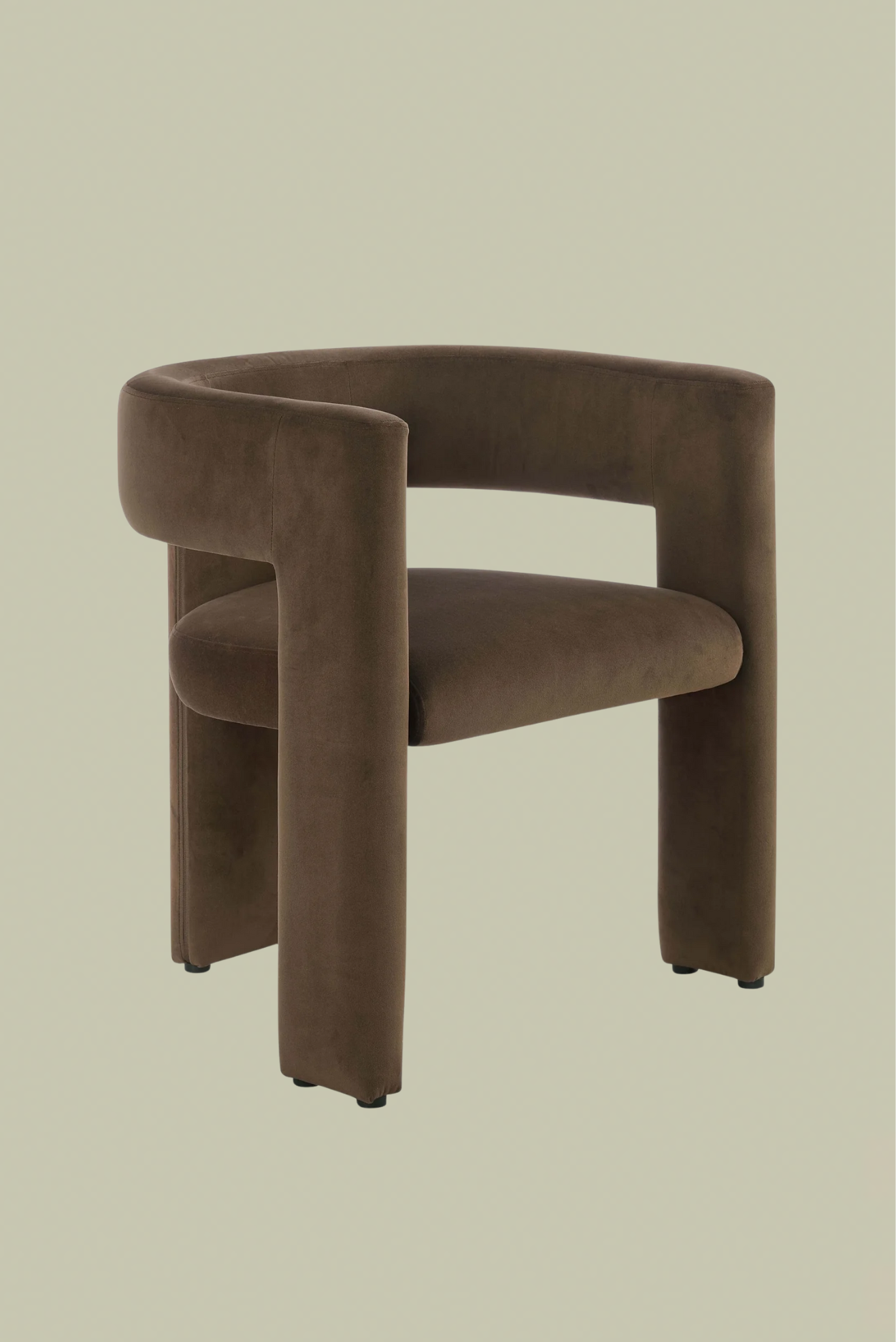 A brown velvet arm chair