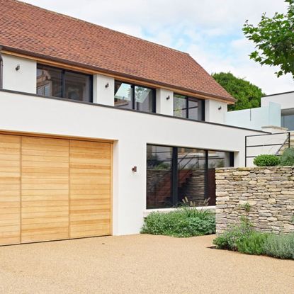 contemporary house with resin bound gravel driveway