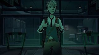 A young man with a backpack in a darkened room