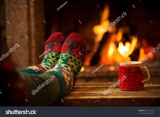 Woolen socks by a Christmas fireplace image by AlexMaster