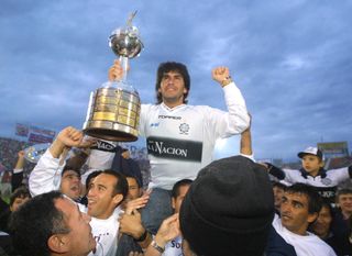 Olimpia players celebrate their Copa Libertadores win in 2002.