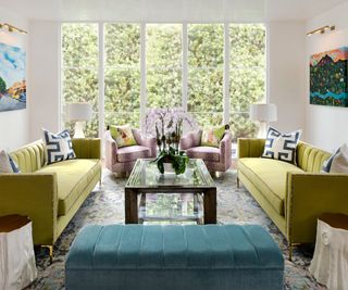 Living room with green sofas and central coffee table
