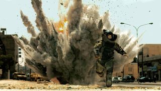 Jeremy Renner running from a bomb explosion in The Hurt Locker