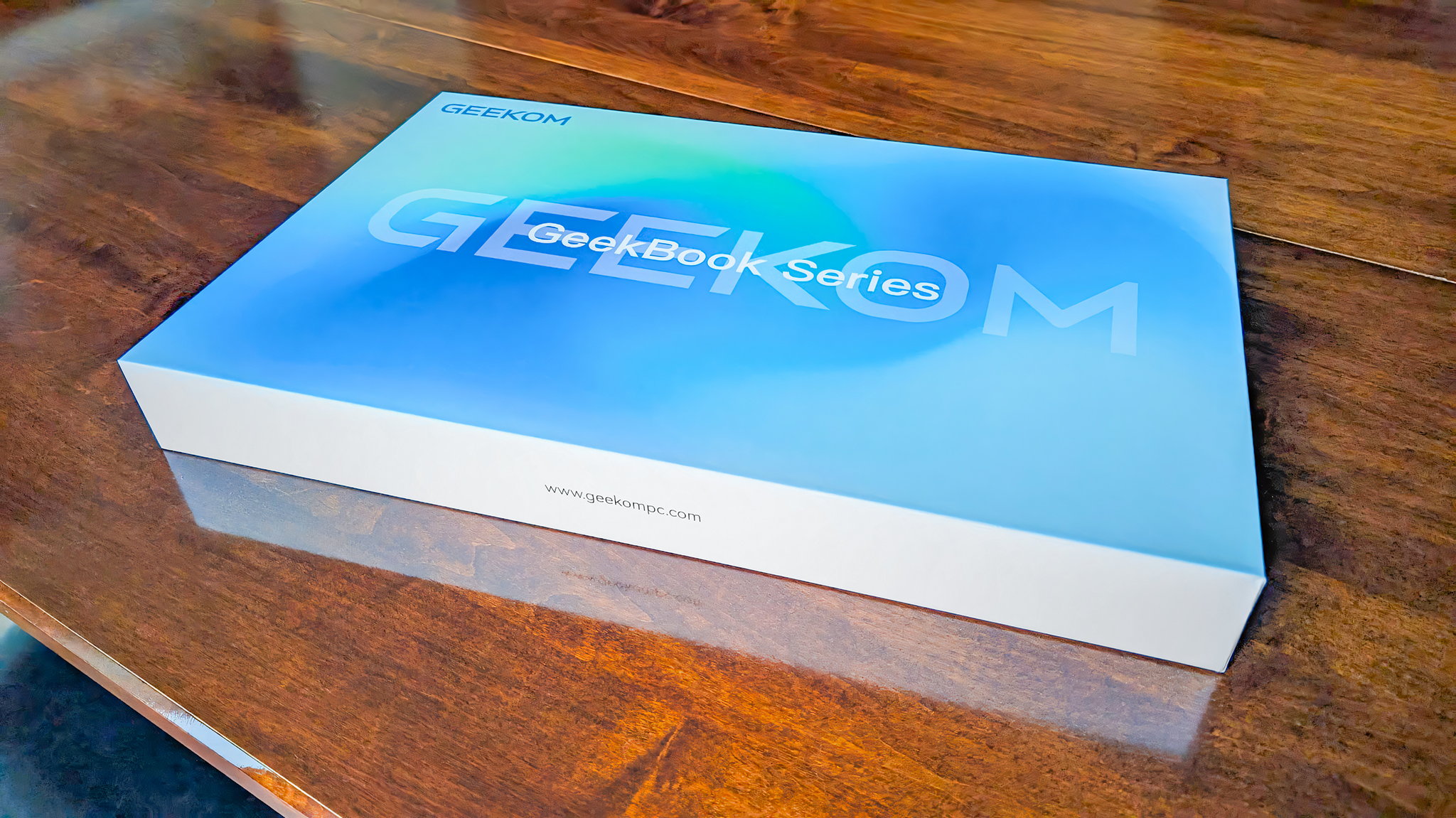 Geekom GeekBook X16 Pro box on a table.
