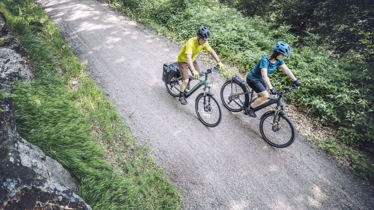 Cube Kathmandu e-bike ridden down a gravel path - best electric bikes