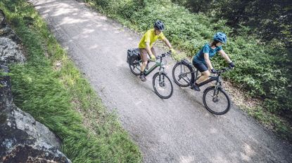 Cube Kathmandu e-bike ridden down a gravel path - best electric bikes