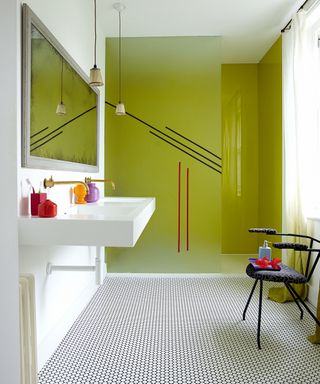 Lime green shower screen with geometric luxury vinyl tile in bathroom by Carpetright