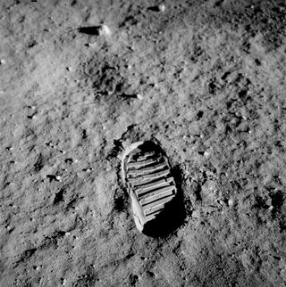 A layer of fine dust and sharp rock shards covers the surface of the moon, as shown in this photo taken by Buzz Aldrin in 1969.