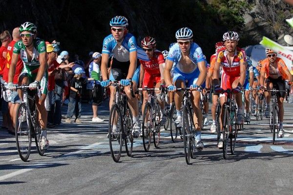 Rivalries put aside and with a common sense of purpose, one of the many small groups on riders approaches five kilometres to go.