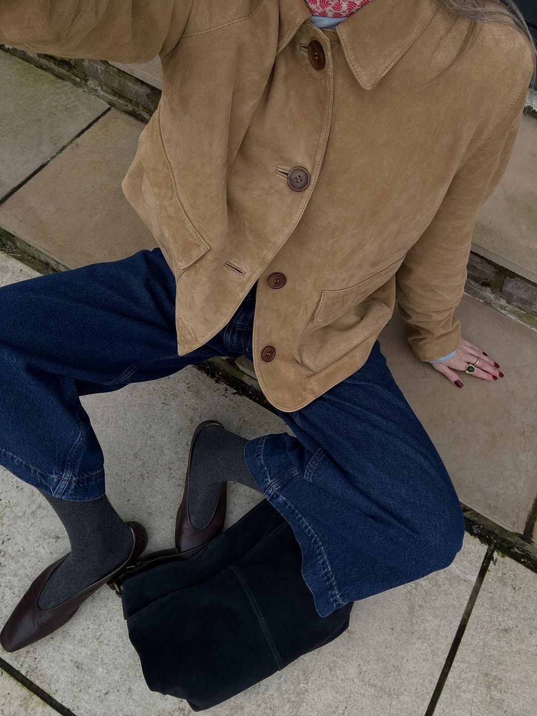 woman wearing suede button down jacket trend 2026