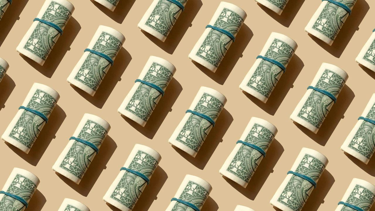 An illustration of several rolls of money tied up with strings.