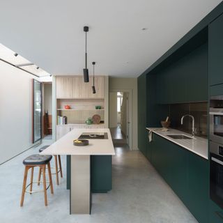 green modern kitchen with kitchen island
