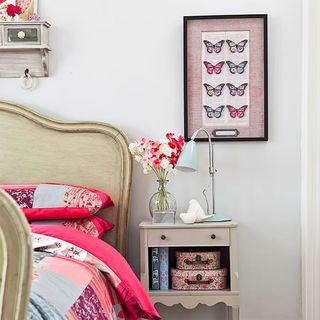 the bedside table was spruced up with dimity by farrow & ball