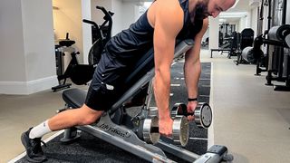 Calum Sharma, personal trainer at the BodyLab, performs the first step of a chest-supported row