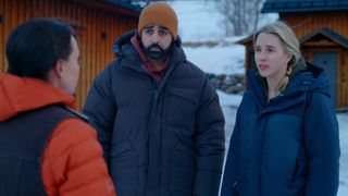 L-R: Daniel Linskog (Kardo Razzazi) and Hanna (Carla Sehn) speak to another resident in Netflix's "The Åre Murders"