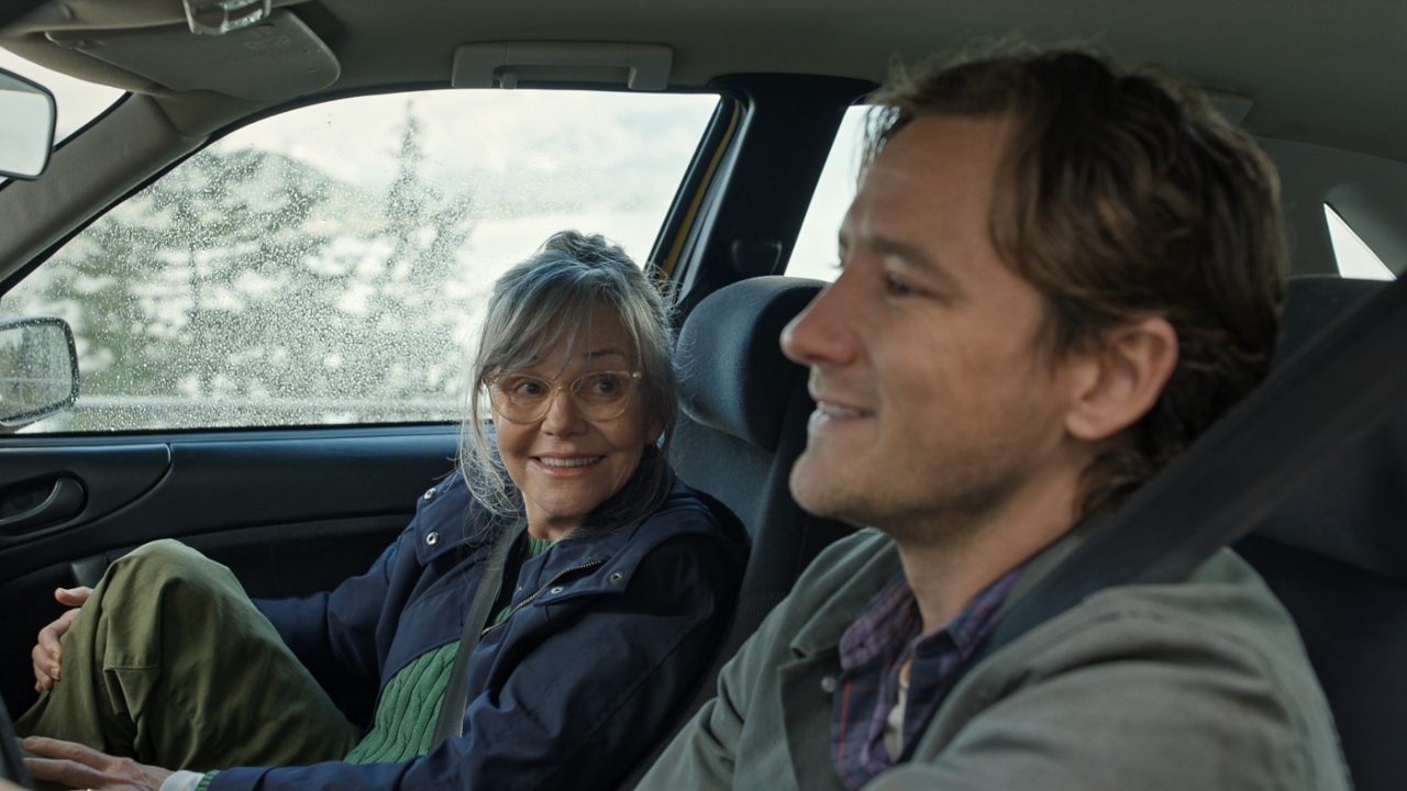 Tova (Sally Field) and Cameron (Lewis Pullman) laugh in Remarkably Bright Creatures.