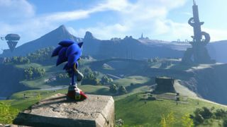 Sonic looks out over green hills in Sonic Frontiers