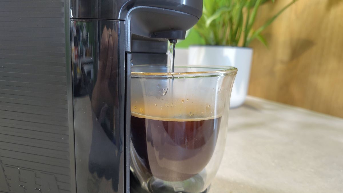 Lavazza Jolie Evo coffee maker dispensing water to make americano