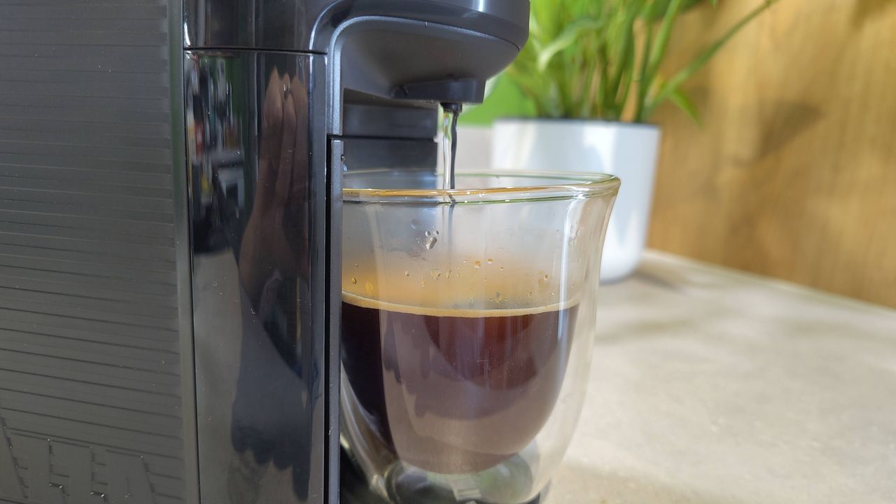 Lavazza Jolie Evo coffee maker dispensing water to make americano