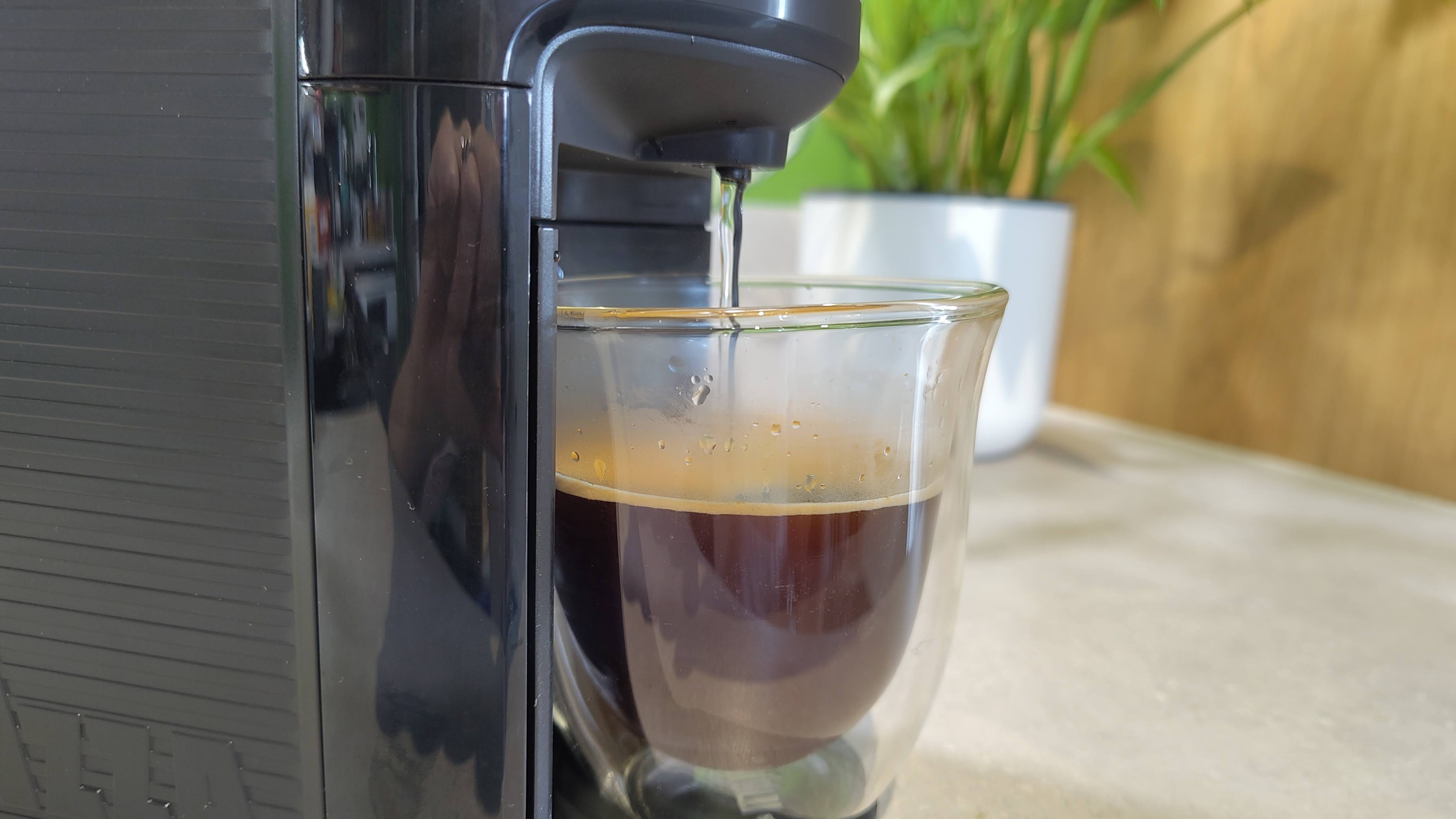 Lavazza Jolie Evo coffee maker dispensing water to make americano