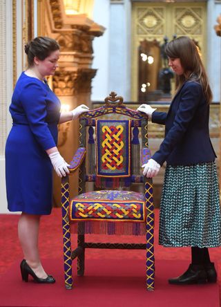 Staff members with a Yoruban throne