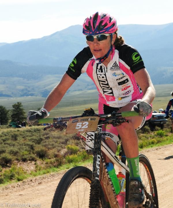 Jenny Smith (NoTubes) rides in fourth place on Columbine Road