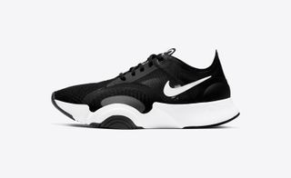 Nike super rep go trainer in black and white against grey background