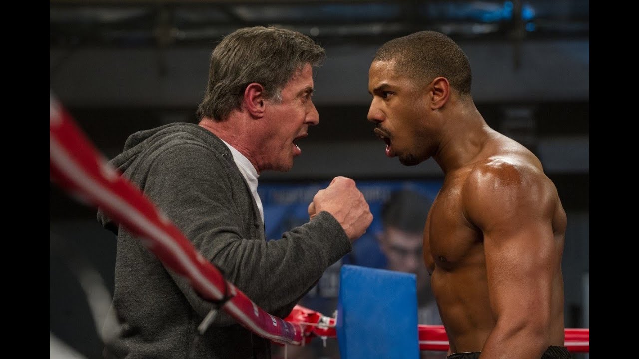 Rocky and Adonis Creed celebrate in 2015 movie Creed