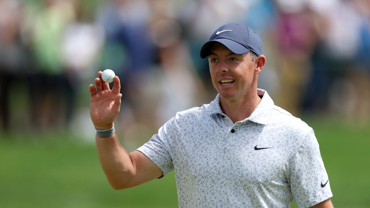 Rory McIlroy waves to the crowd after making a hole-in-one at the 2022 Travelers Championship.