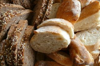 Whole wheat vs white bread: less-processed is better for slimming down.