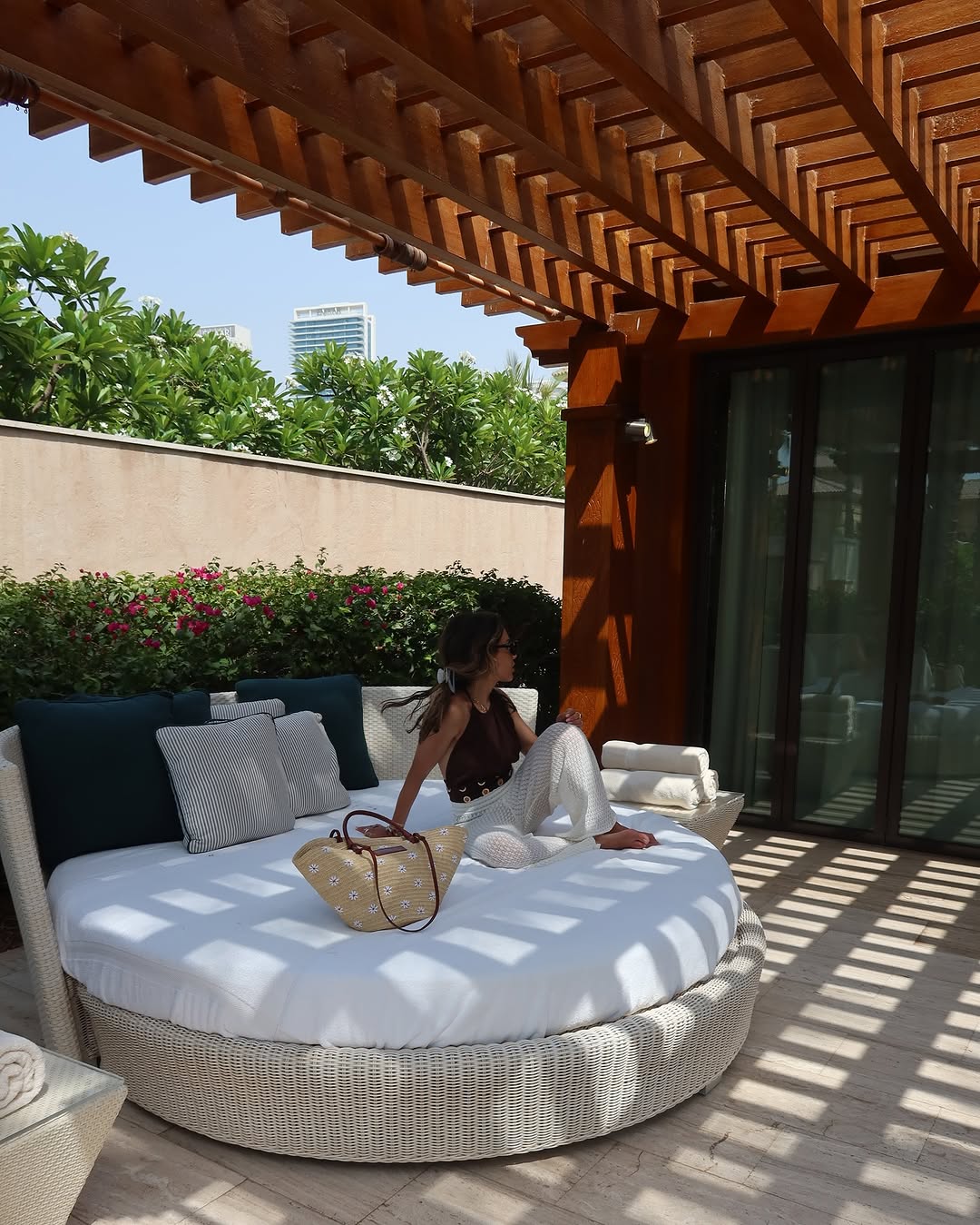 Leila in a sun bed with a Loewe bag