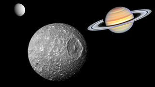 An illustration shows Saturn's moon Mimas with the gas giant and Enceladus in the background.