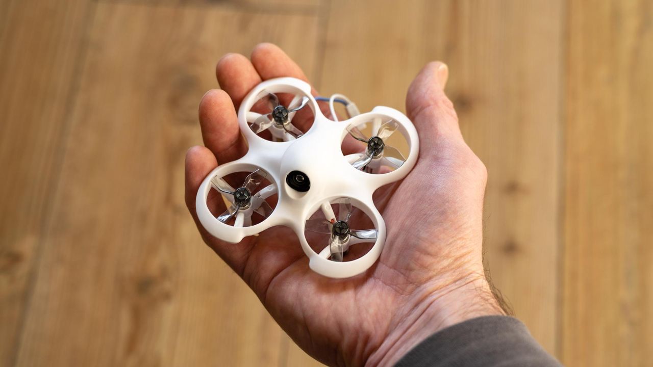 BetaFPV Cetus Lite FPV Kit- drone in hand for scale.
