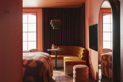 A red and orange palette in a bedroom