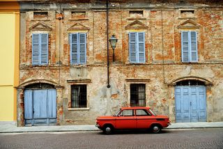 Red car on Italian street.