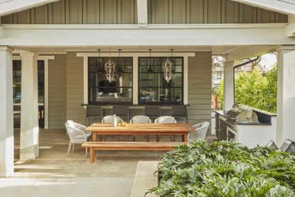 A long dining table in the shade