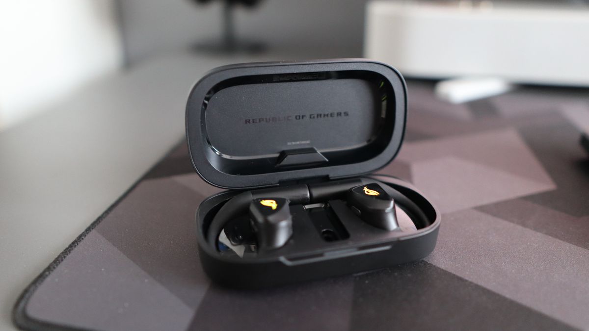 Asus ROG Cetra Open earbuds on a deskmat.